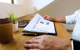 Businessman working with income statement document